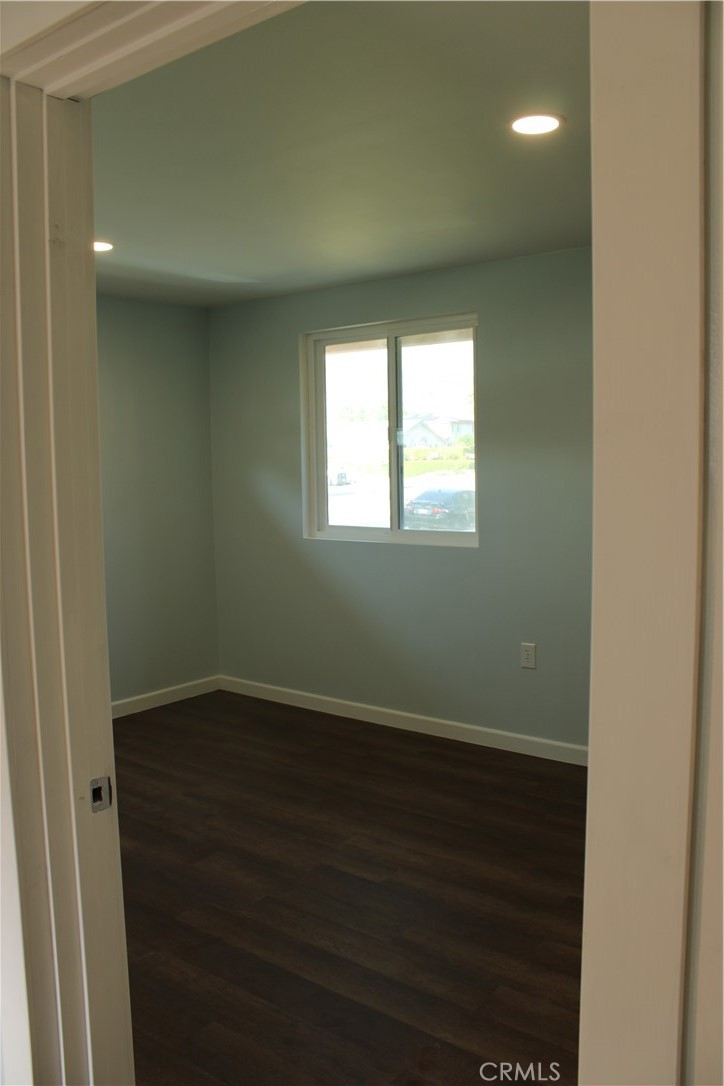 5776 Katherine Street Simi Valley, CA 93063 - Photo 10 of 15 an empty room with wooden floor and windows