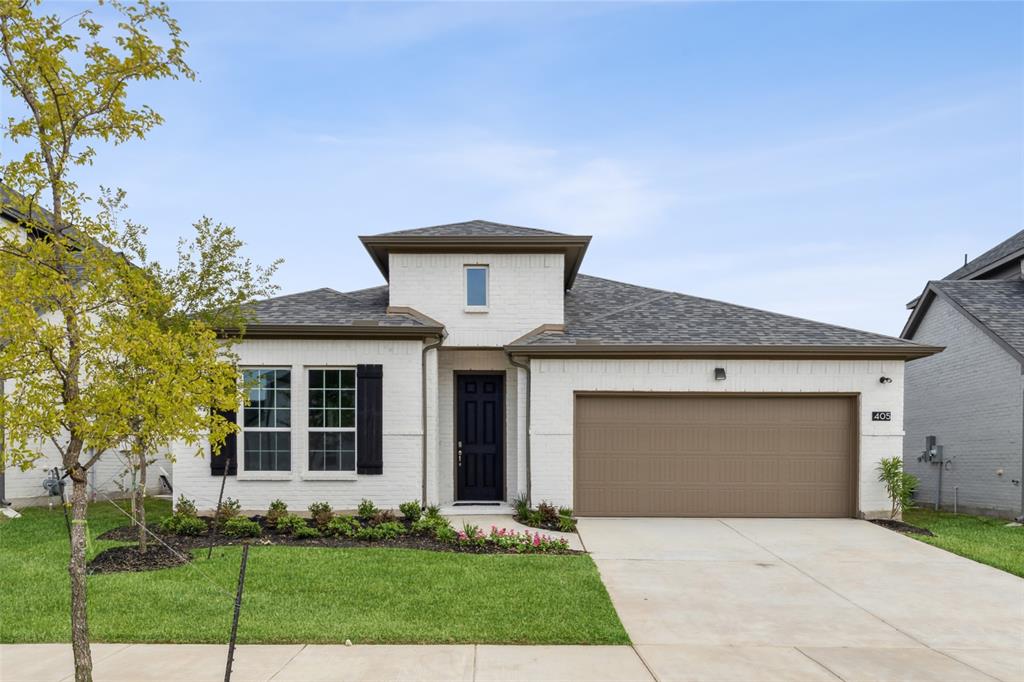 405 Hoot Owl Hill Celina, TX 75009 - Photo 1 of 1 a front view of a house with a garden and yard