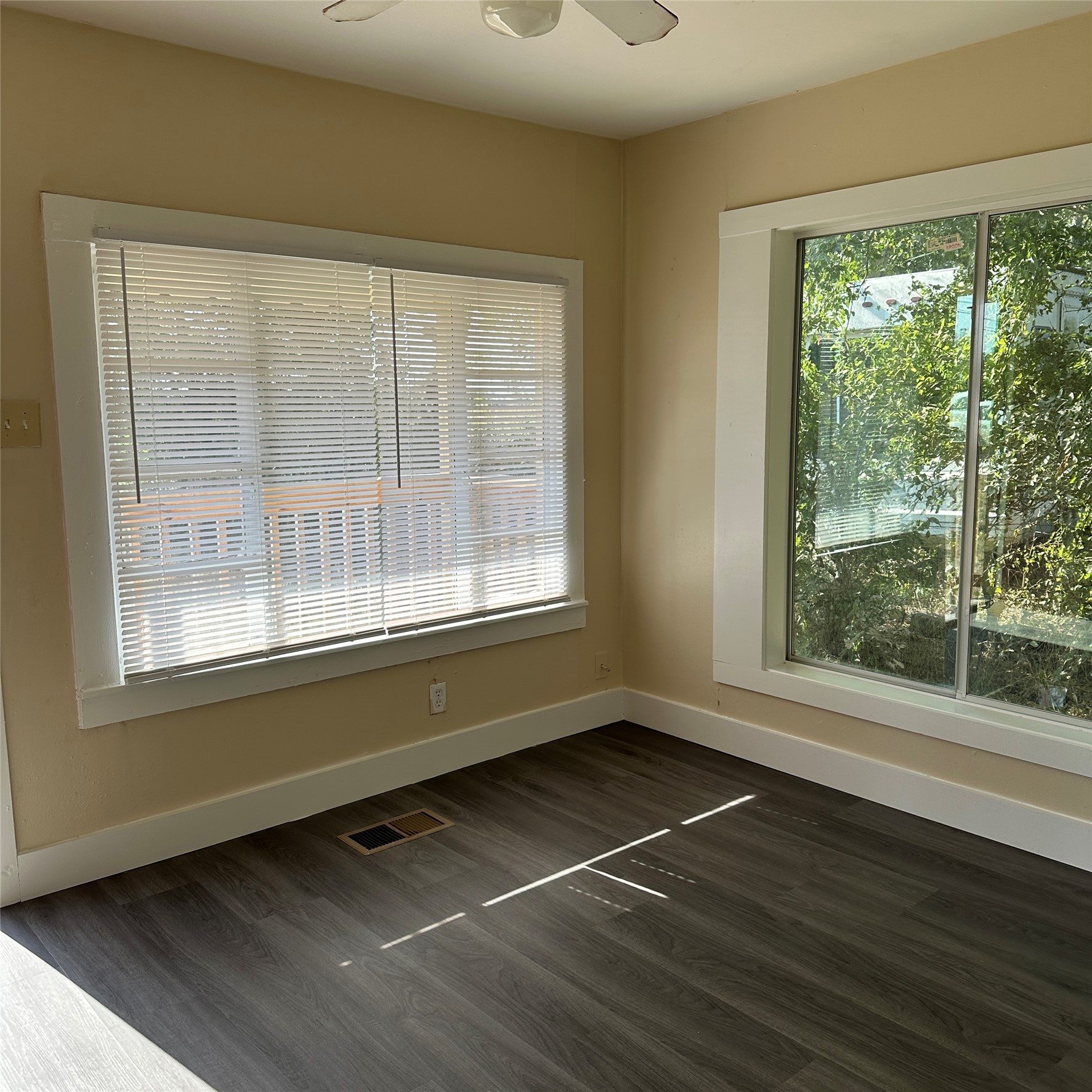1321 Harris Hill Road San Marcos, TX 78666 - Photo 2 of 11 a view of an empty room with wooden floor and a window