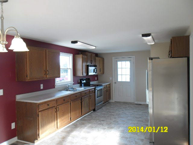 6933 Briery Branch Road Dayton, VA 22821 - Photo 5 of 17 a kitchen with a sink cabinets and counter space