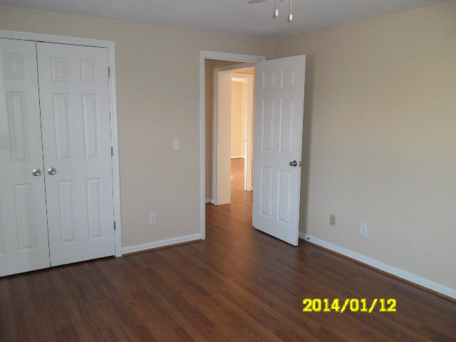 6933 Briery Branch Road Dayton, VA 22821 - Photo 9 of 17 an empty room with wooden floor and closet
