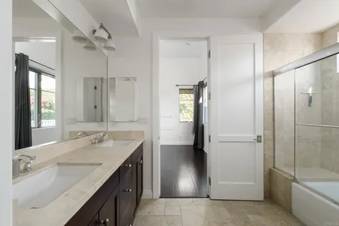 a kitchen with stainless steel appliances a sink and cabinets