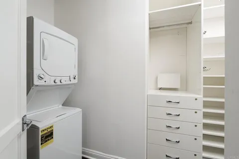 a kitchen with a sink a refrigerator and a stove