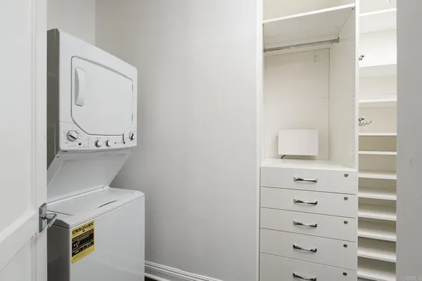 a kitchen with a sink a refrigerator and a stove