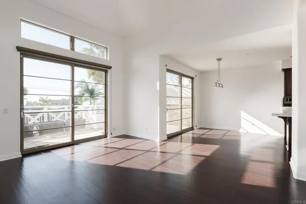 a kitchen with stainless steel appliances a sink a stove a refrigerator and cabinets