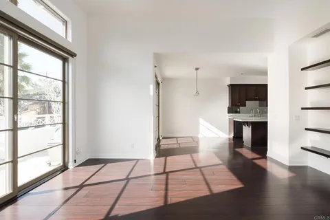 a bathroom with a granite countertop sink mirror vanity and toilet