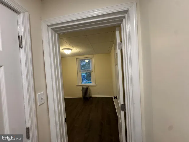 a view of a bathroom from a hallway