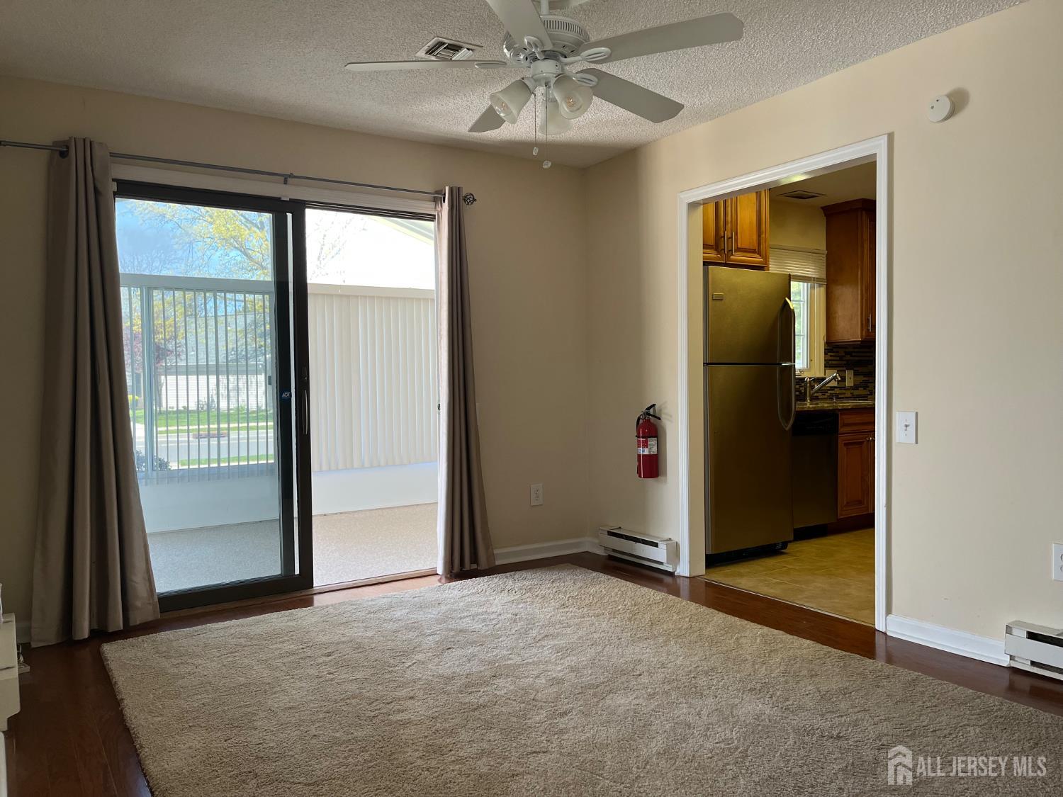 333 Newport Way, Unit C Monroe Township, NJ 08831 - Photo 16 of 17 an empty room with windows and closet