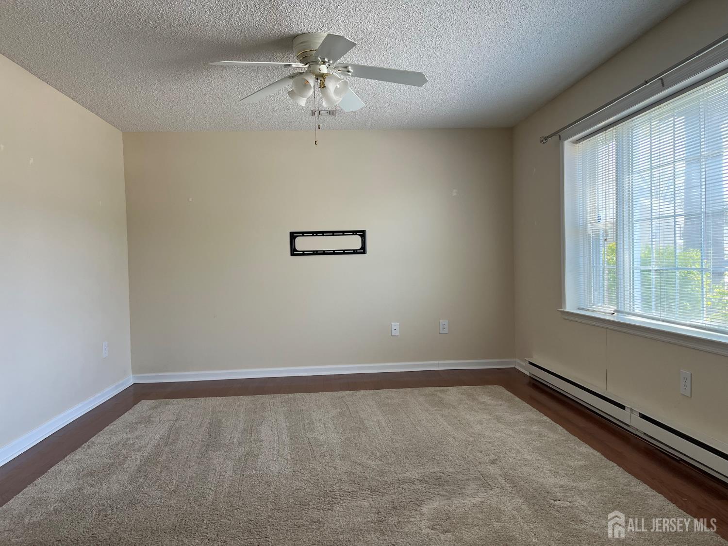 333 Newport Way, Unit C Monroe Township, NJ 08831 - Photo 17 of 17 a view of an empty room with a window