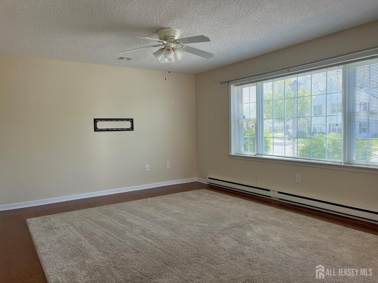 333 Newport Way, Unit C Monroe Township, NJ 08831 - Photo 3 of 17 a view of an empty room with a window