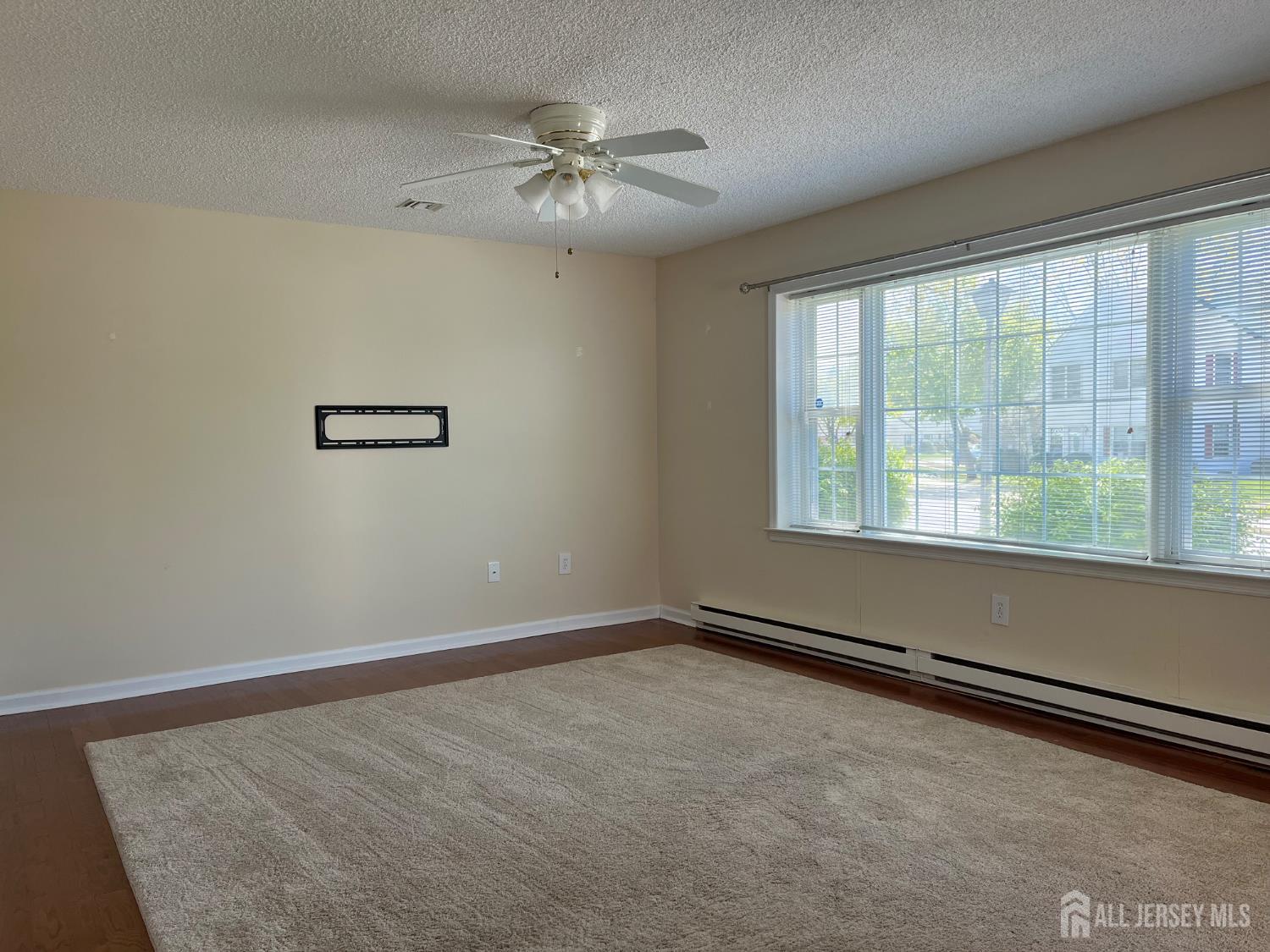 333 Newport Way, Unit C Monroe Township, NJ 08831 - Photo 5 of 17 a view of an empty room with a window