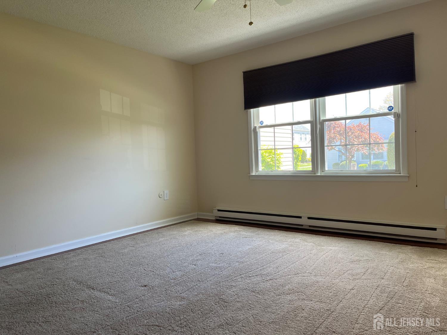 333 Newport Way, Unit C Monroe Township, NJ 08831 - Photo 7 of 17 an empty room with a window