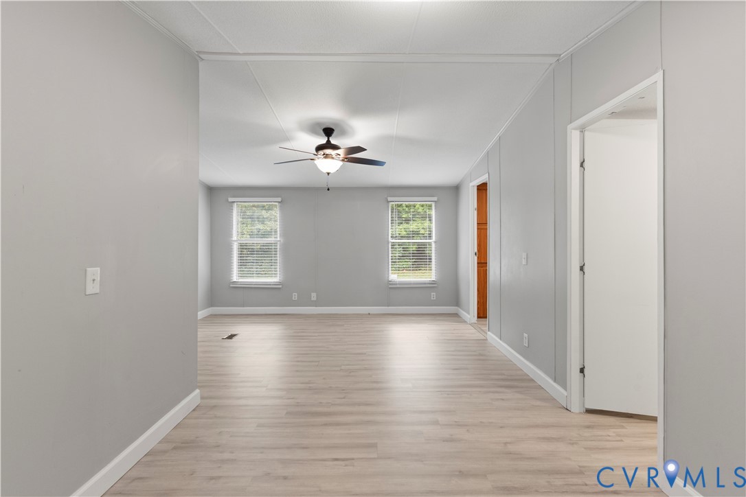 403 Virso Road Meherrin, VA 23954 - Photo 14 of 33 a view of an empty room with wooden floor and a window