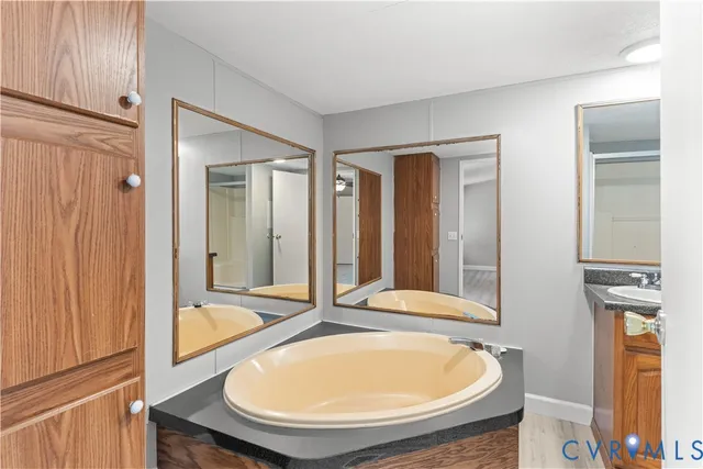 a bathroom with a tub and shower