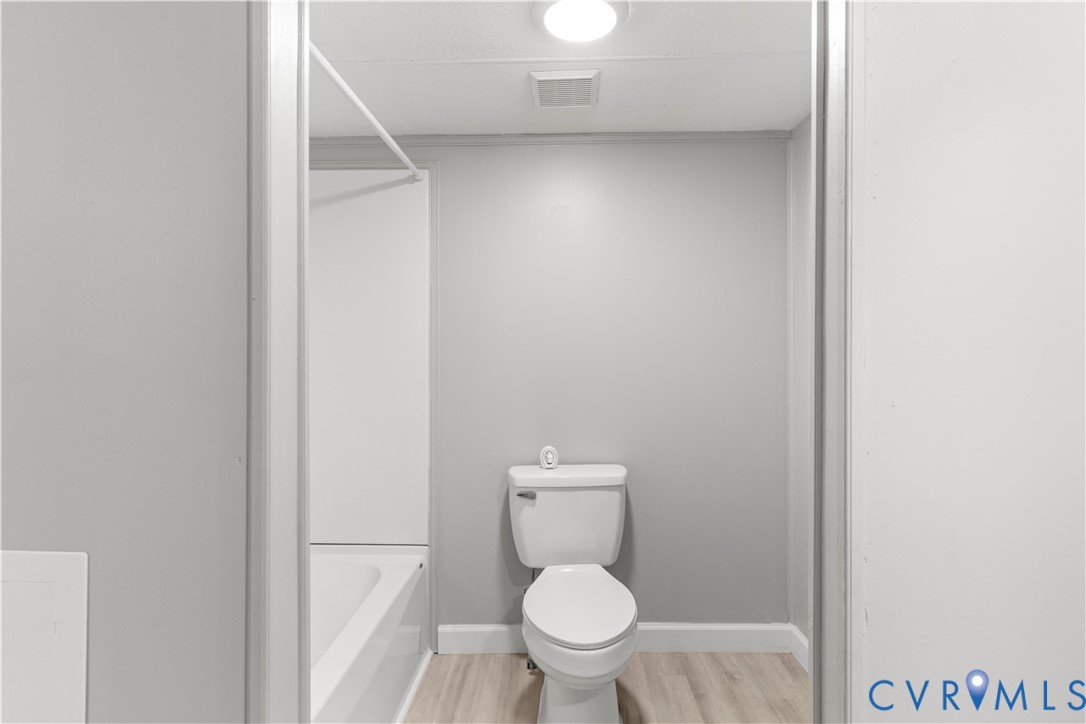 403 Virso Road Meherrin, VA 23954 - Photo 26 of 33 a white toilet sitting next to a shower