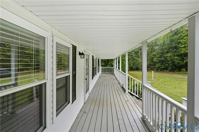 a view of a balcony with wooden floor
