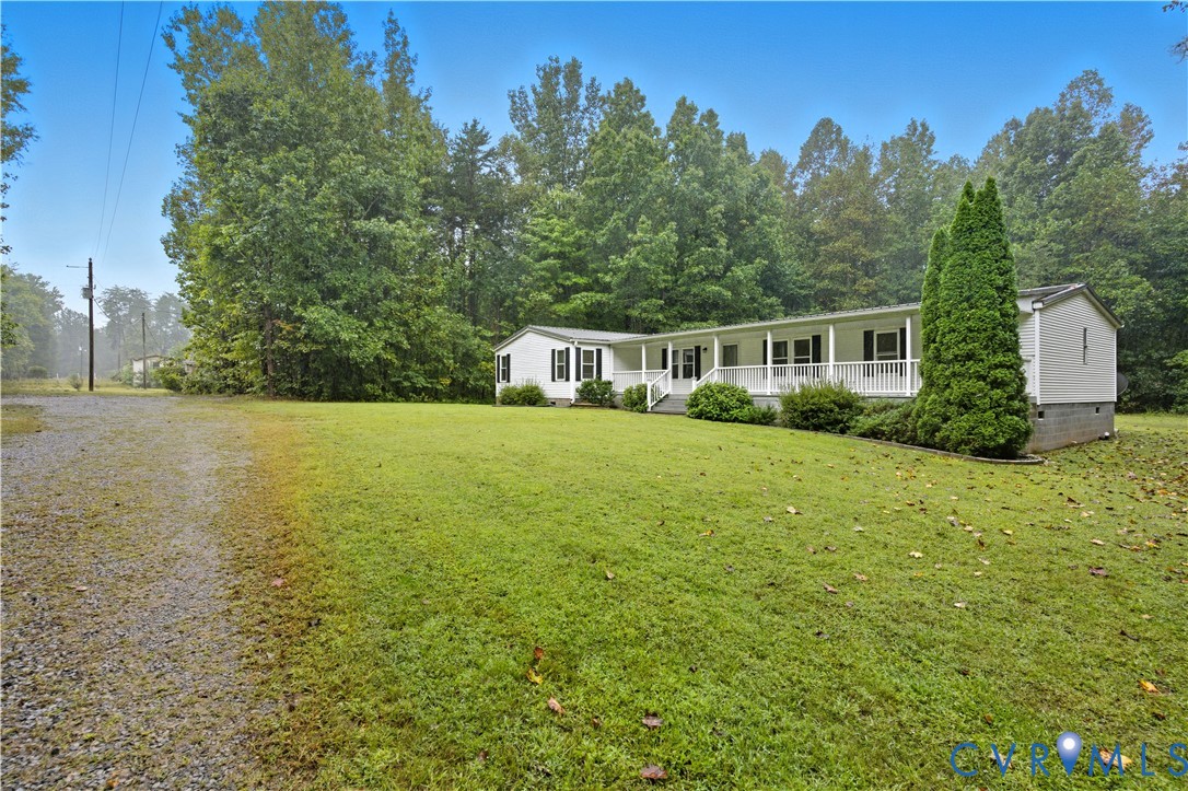 403 Virso Road Meherrin, VA 23954 - Photo 29 of 33 a view of a house with yard and trees in the background