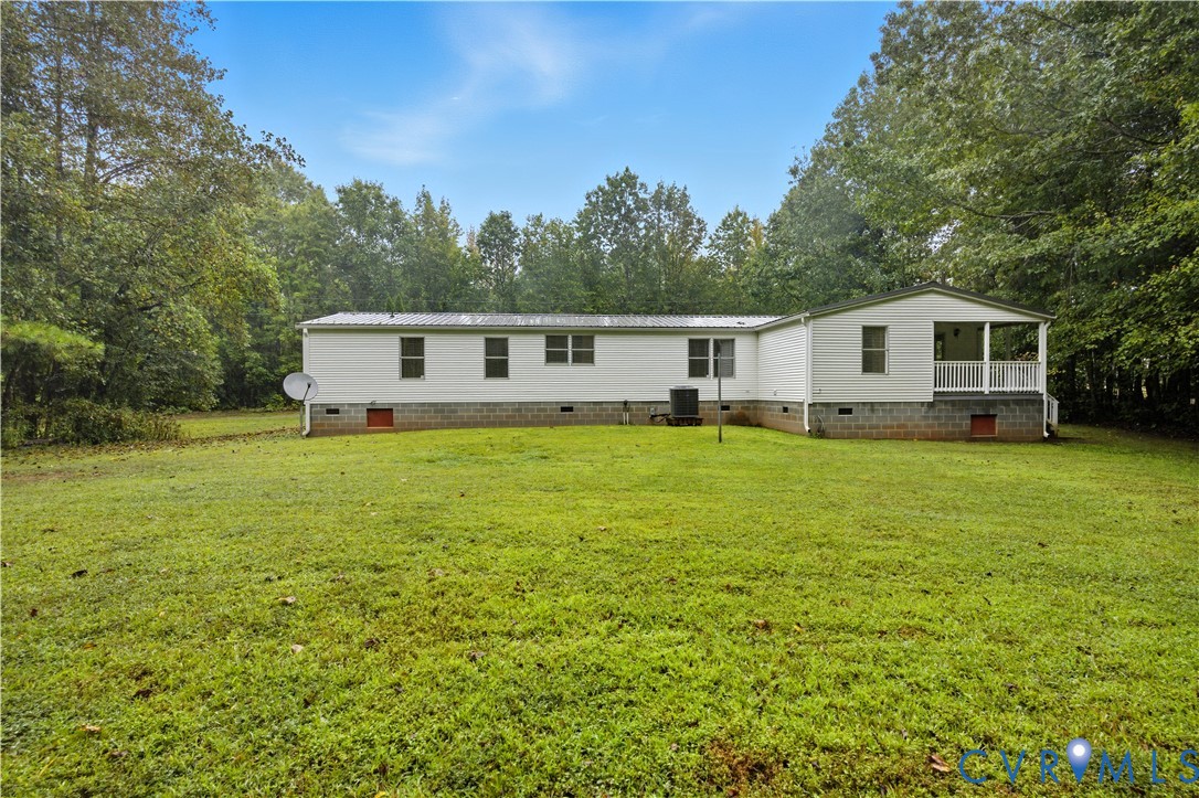 403 Virso Road Meherrin, VA 23954 - Photo 30 of 33 a white house that has a big yard with wooden fence
