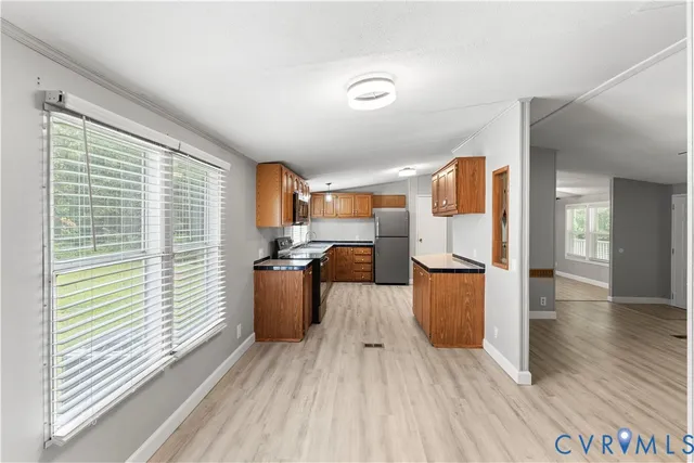 a view of kitchen with furniture and wooden floor