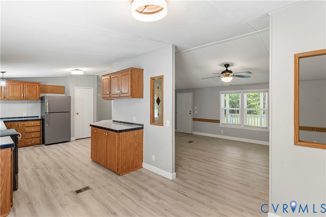 403 Virso Road Meherrin, VA 23954 - Photo 6 of 33 a kitchen with stainless steel appliances granite countertop a refrigerator and a stove top oven