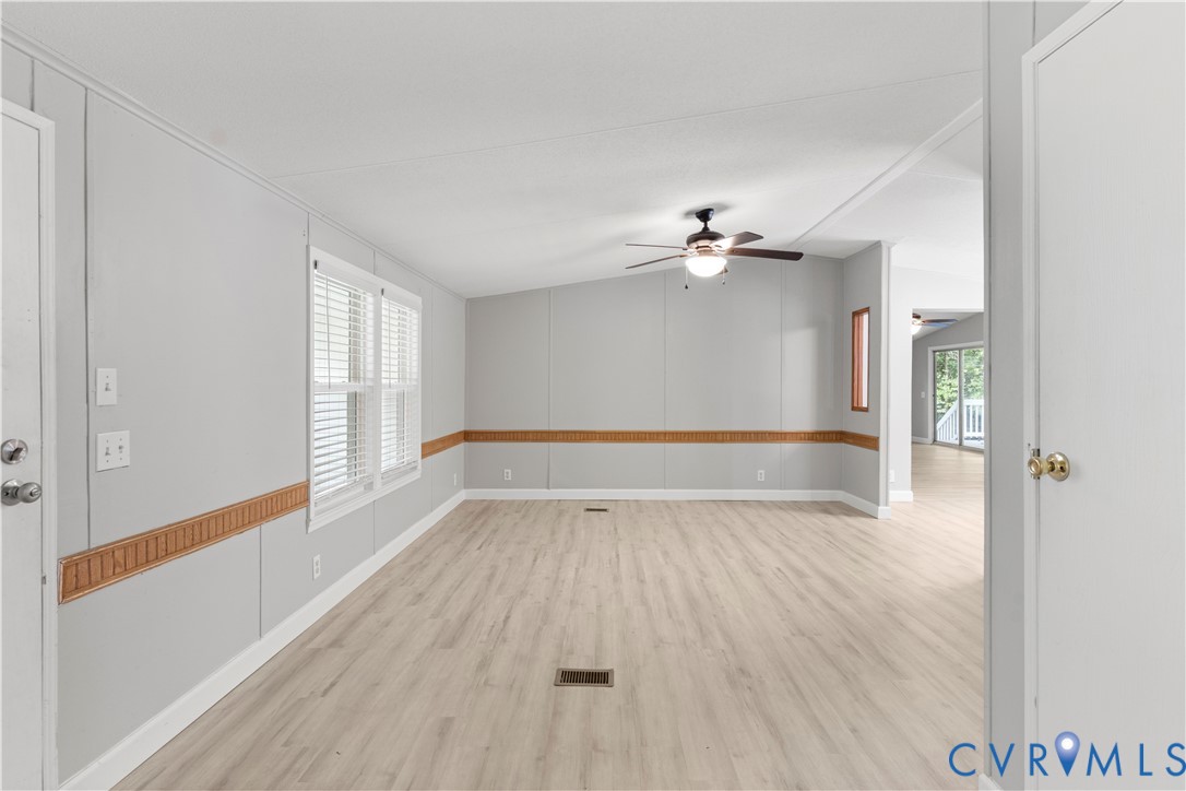 403 Virso Road Meherrin, VA 23954 - Photo 10 of 33 a view of an empty room with a window and wooden floor