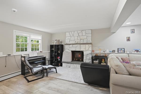 31 Laura Road Monroe, NY 10950 - Photo 32 of 39 a living room with furniture and a fireplace