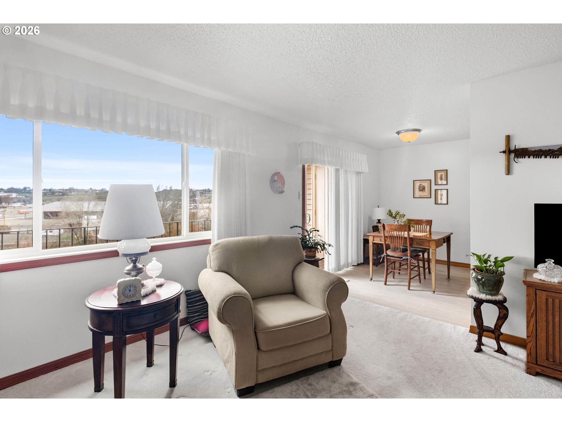 1900 Northwest Carden Avenue, Unit 22 Pendleton, OR 97801 - Photo 11 of 29 a living room with furniture a table and a large window