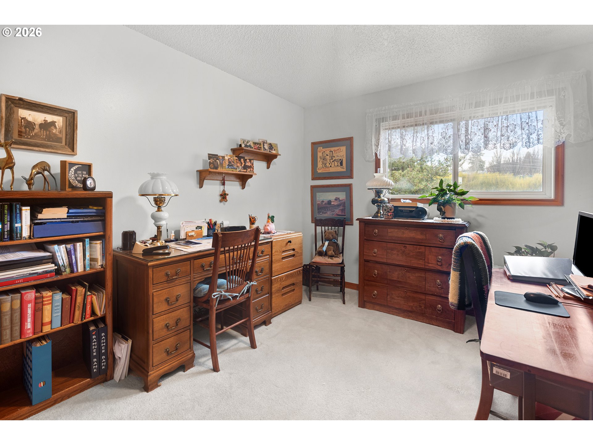 1900 Northwest Carden Avenue, Unit 22 Pendleton, OR 97801 - Photo 22 of 29 a view of a workspace with furniture and a bookshelf