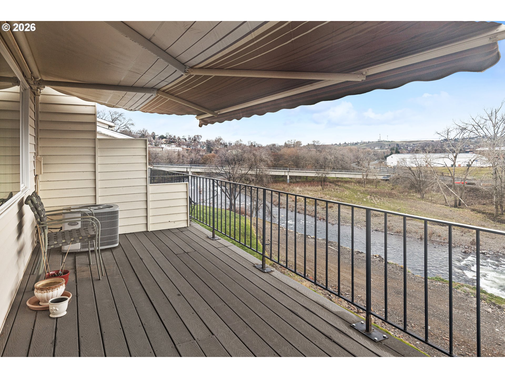 1900 Northwest Carden Avenue, Unit 22 Pendleton, OR 97801 - Photo 23 of 29 a view of balcony with wooden floor and outdoor seating