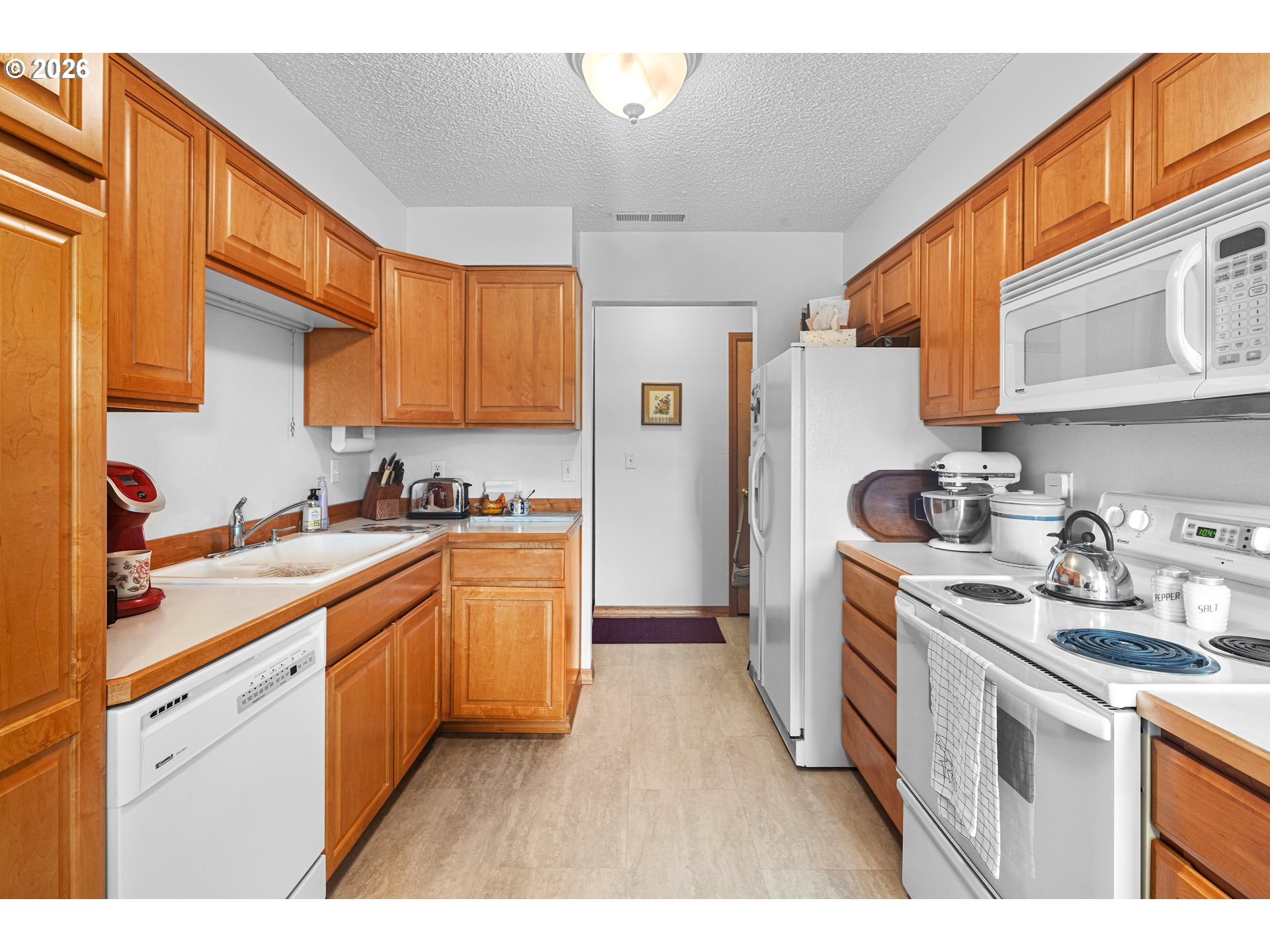 1900 Northwest Carden Avenue, Unit 22 Pendleton, OR 97801 - Photo 5 of 29 a kitchen with stainless steel appliances granite countertop a sink stove and refrigerator