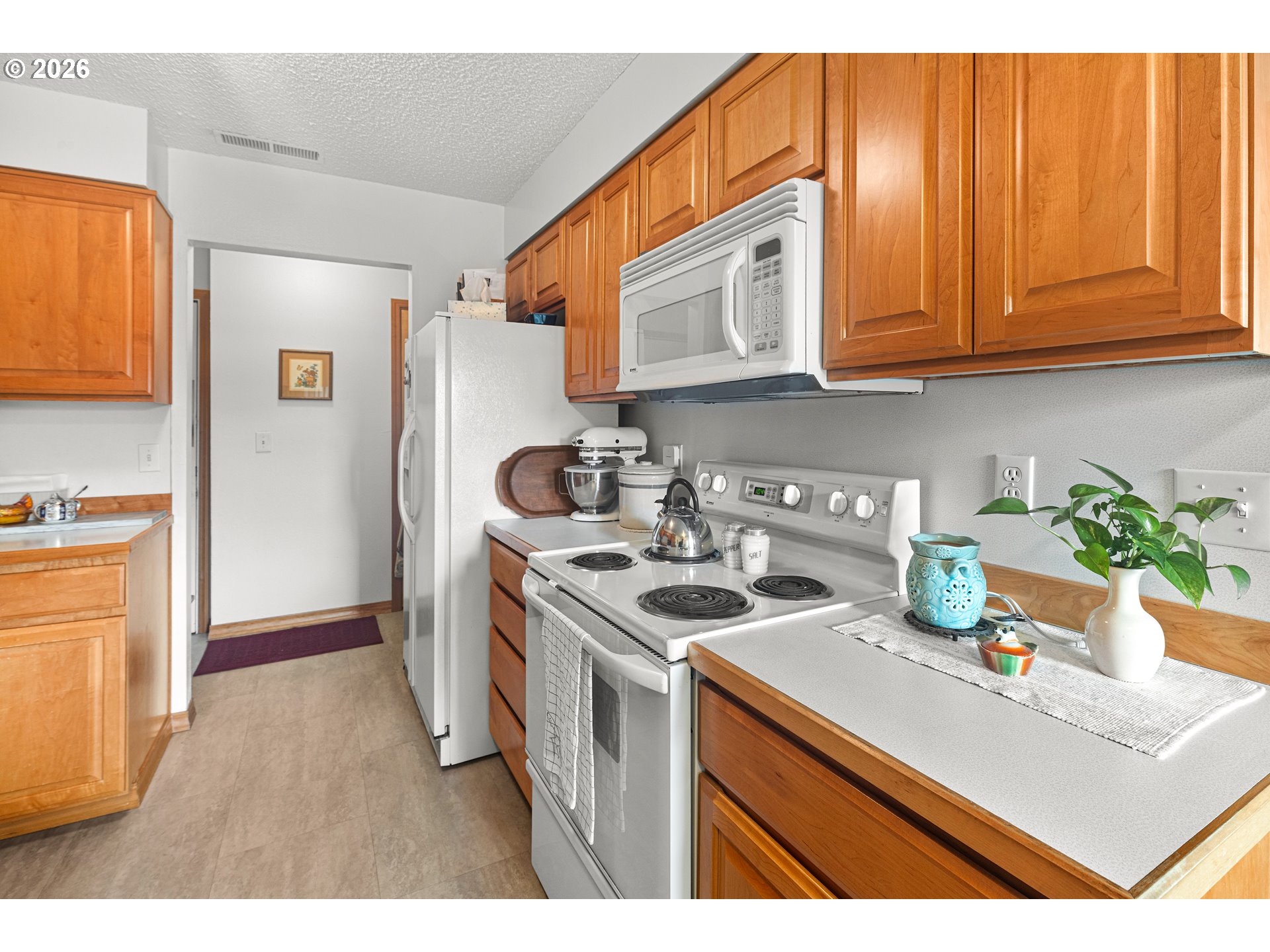 1900 Northwest Carden Avenue, Unit 22 Pendleton, OR 97801 - Photo 8 of 29 a kitchen with stainless steel appliances granite countertop a sink stove and refrigerator
