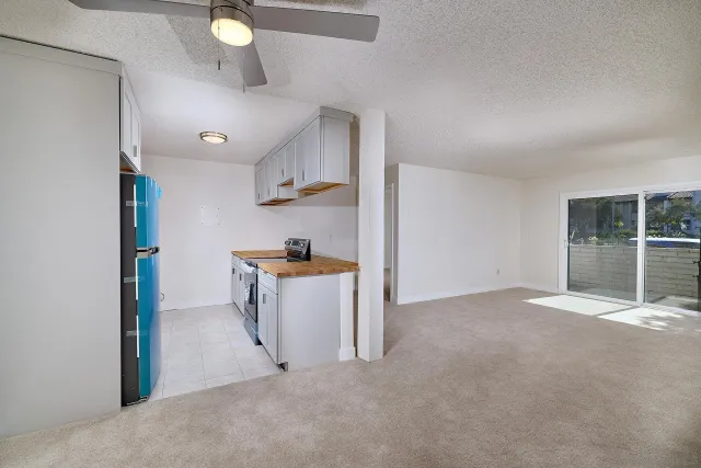 a view of a kitchen with a sink cabinets and a window
