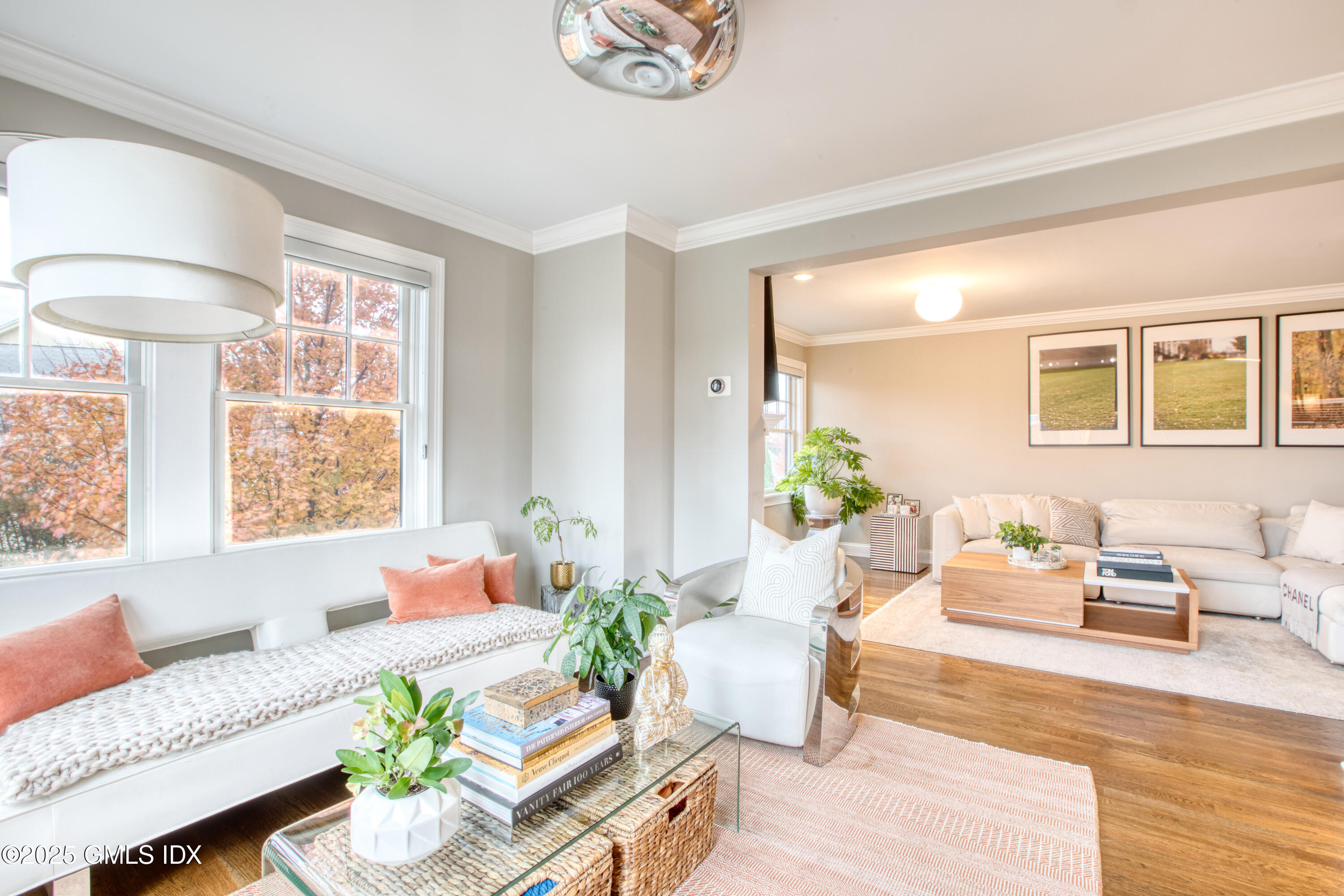 24 Harold Street, Unit E Cos Cob, CT 06807 - Photo 14 of 36 a living room with furniture and a large window