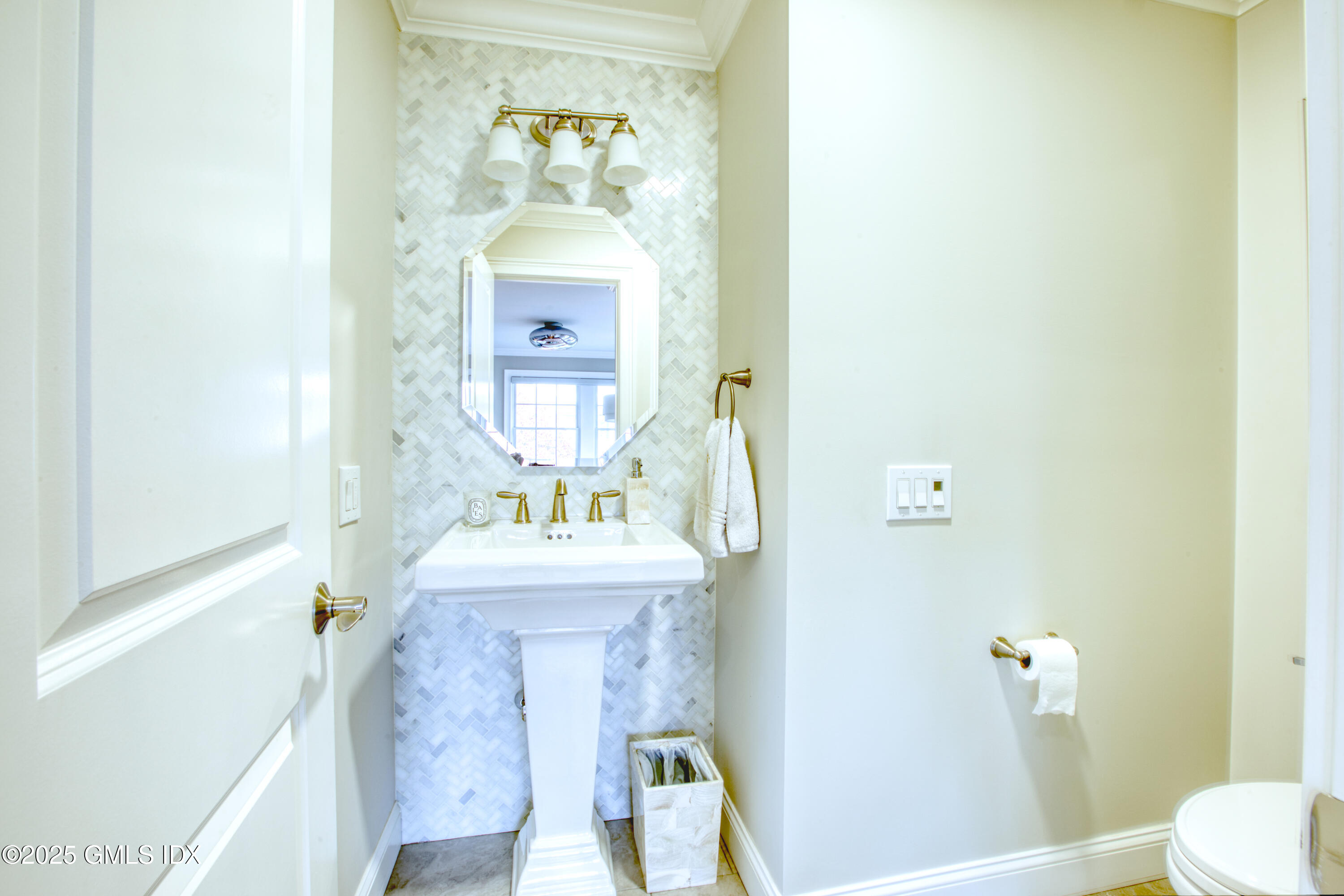 24 Harold Street, Unit E Cos Cob, CT 06807 - Photo 17 of 36 a bathroom with a sink a mirror and a toilet