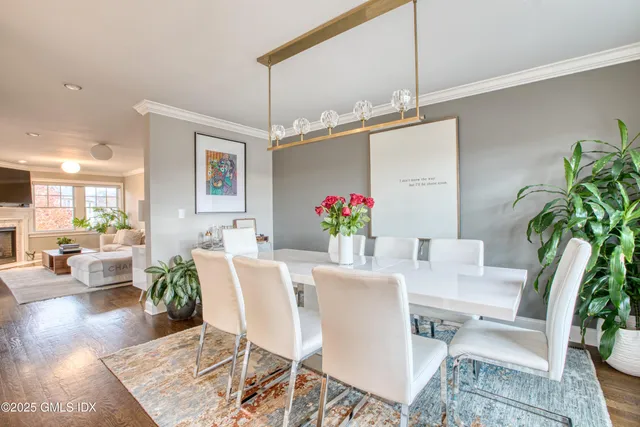 a kitchen with stainless steel appliances granite countertop a stove a sink a center island and a cabinets