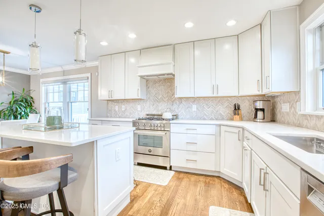a kitchen with kitchen island a sink a counter and appliances