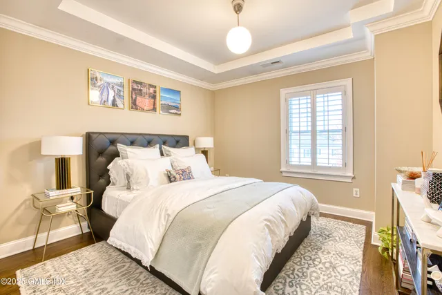 a bedroom with a bed and a mirror