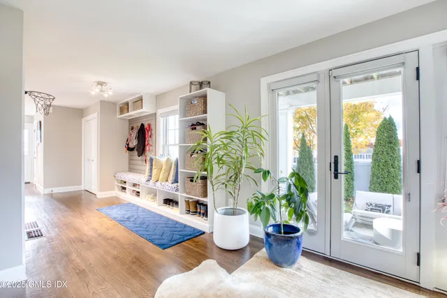 a bathroom with a toilet a sink and a mirror
