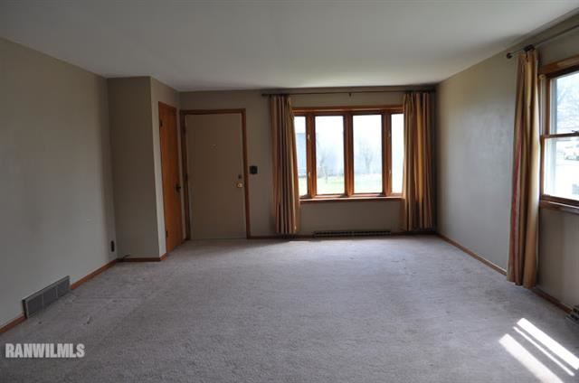 727 West Walnut Road Freeport, IL 61032 - Photo 3 of 11 a view of empty room with windows