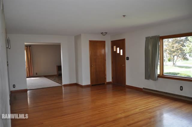 727 West Walnut Road Freeport, IL 61032 - Photo 5 of 11 a view of a room with wooden floor and window