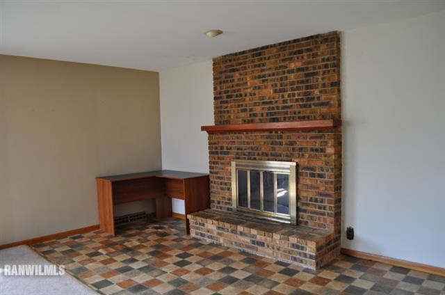 727 West Walnut Road Freeport, IL 61032 - Photo 6 of 11 a living room with a fireplace