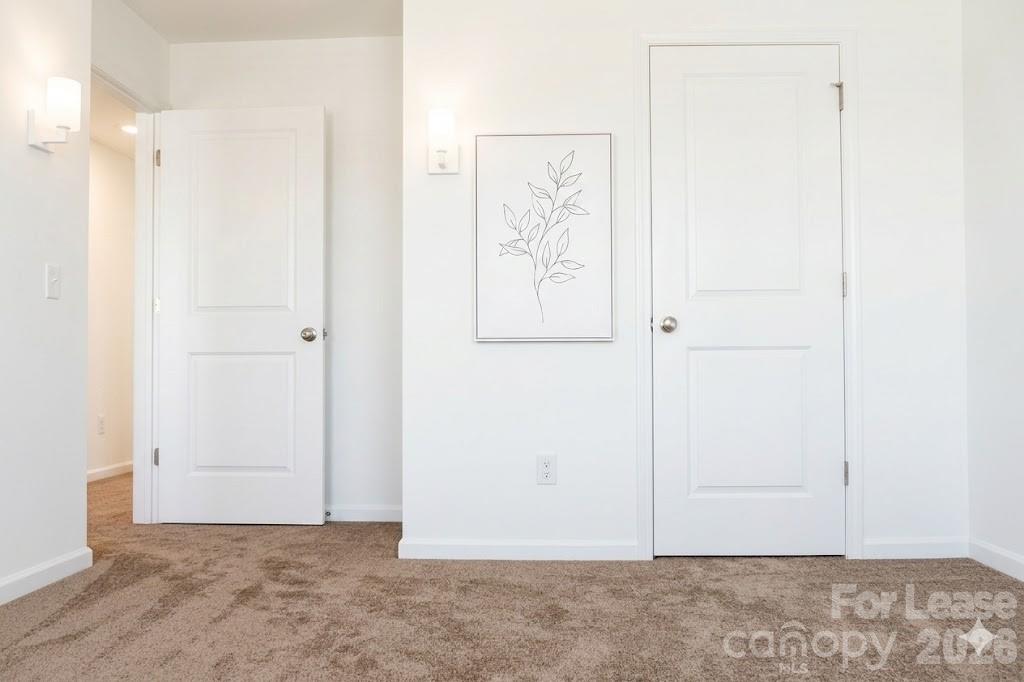1215 Nesters Store Place Southwest Concord, NC 28027 - Photo 12 of 16 an empty room with closet
