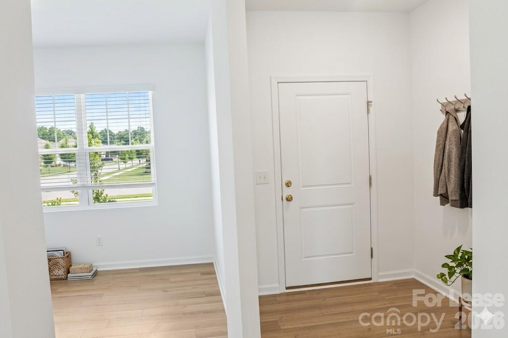 1215 Nesters Store Place Southwest Concord, NC 28027 - Photo 2 of 16 a view of walk in closet with clothes and shoes