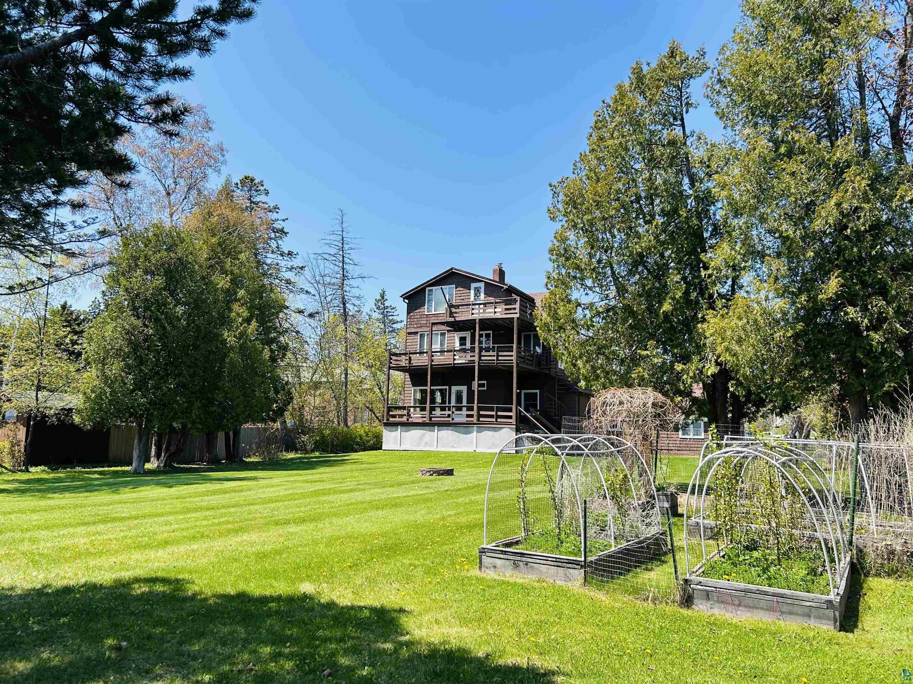 5090 London Road, Unit 1 Duluth, MN 55804 - Photo 52 of 54 Spacious property featuring a multi-story residence with multiple balconies