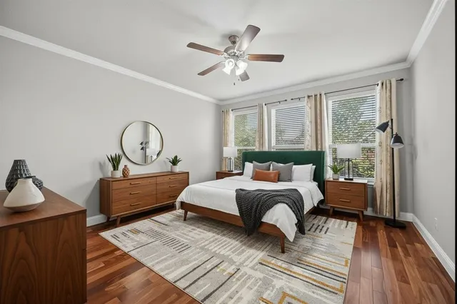 a bedroom with a large bed and a window