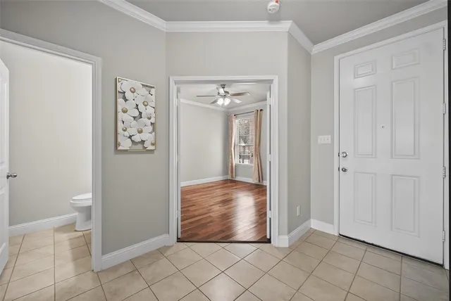 an empty room with windows and bathroom