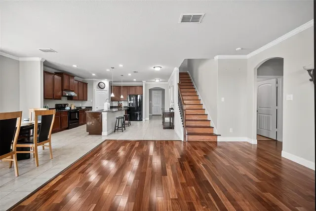 a view of kitchen with furniture and wooden floor