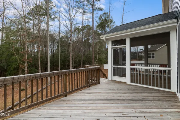 a view of deck with wooden floor and fence