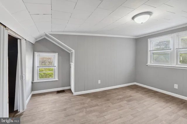 a view of a house with a yard and garage