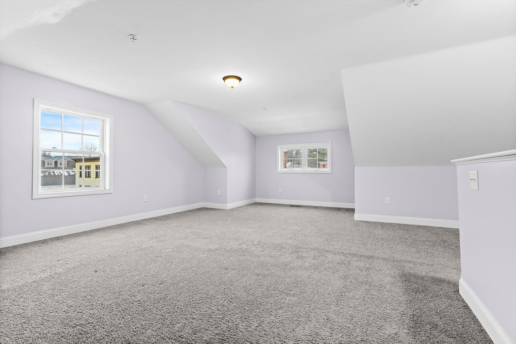 7 Butler Avenue, Unit 5 Lowell, MA 01852 - Photo 20 of 28 an empty room with windows